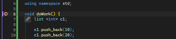 Visual Studio で、設定されたブレークポイントでデバッガーが一時停止していることを示すスクリーンショット。